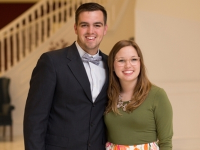 Staci Beene and Jacob Alger standing together in the chapel foyer.