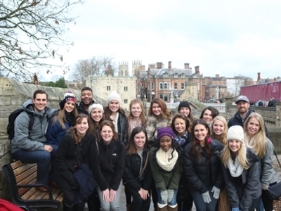 The DBU Patriettes dance team along with DBU staff sponsors in England.