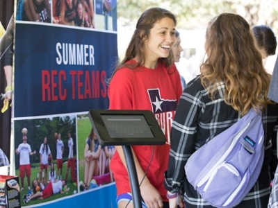 A DBU Student talks to another about the DBU rec team