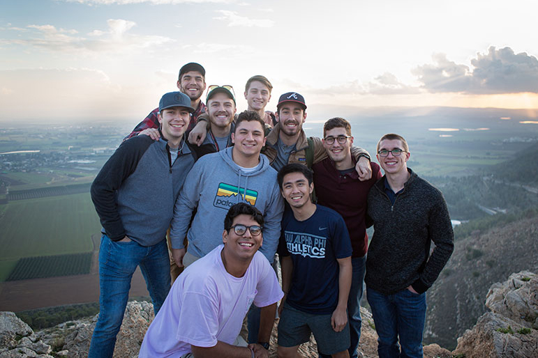 A group of DBU students in front of a valley in Israel