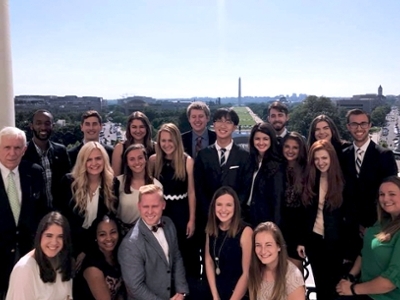Students pose in front of the Washington Monument