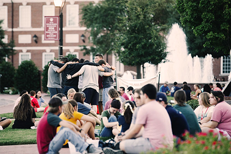 DBU students making friends and praying for one another as they prepare for the start of the Fall semester.
