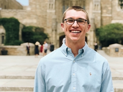 Blake stands outside of the Yale School of Medicine