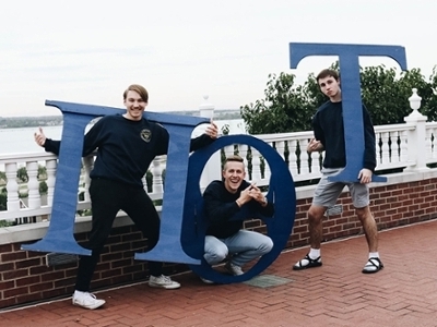 Pi Theta Tau boys pose with their Greek letters