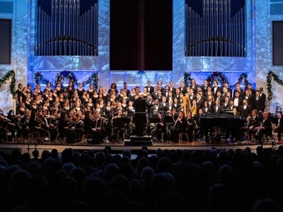 The DBU Grand Chorus performs on stage in the Chapel with a full orchestra, conducted by Dr. Stephen Holcomb