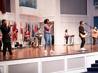Students singing on Chapel stage