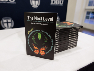 picture of Dr. Marcus Goodloe's book: The Next Level on table