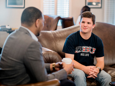 male talking to a student