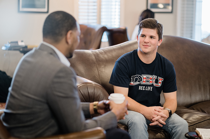 male talking to a student