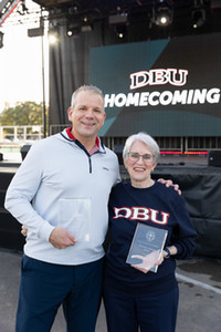 Ted Hebert and Helen Rasberry with alumni awards