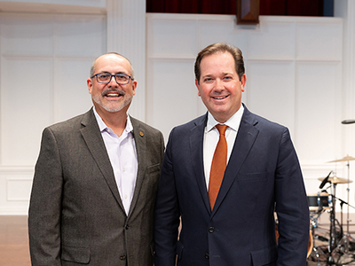 Julio Guarneri and Dr. Adam Wright standing in the chapel