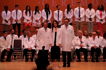 picture of Chloe in her white coat standing on stage