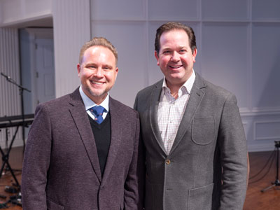 Dr. Jeremiah Johnston standing with Dr. Adam C. Wright