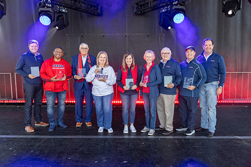 Homecoming Distinguished Alumni standing in a group with Dr. Wright