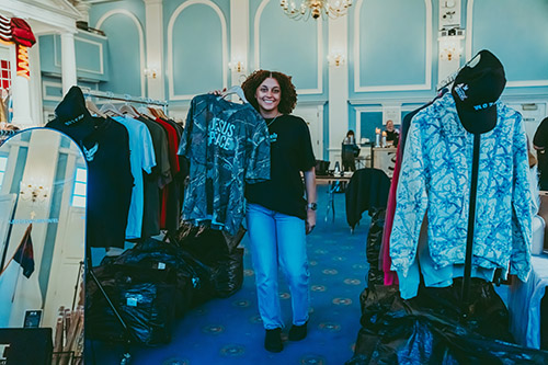 DBU student holding up a jireh shalom apparel t-shirt