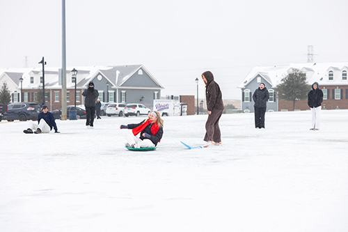 college students playing in the snow on the intramural field in Dallas, Texas
