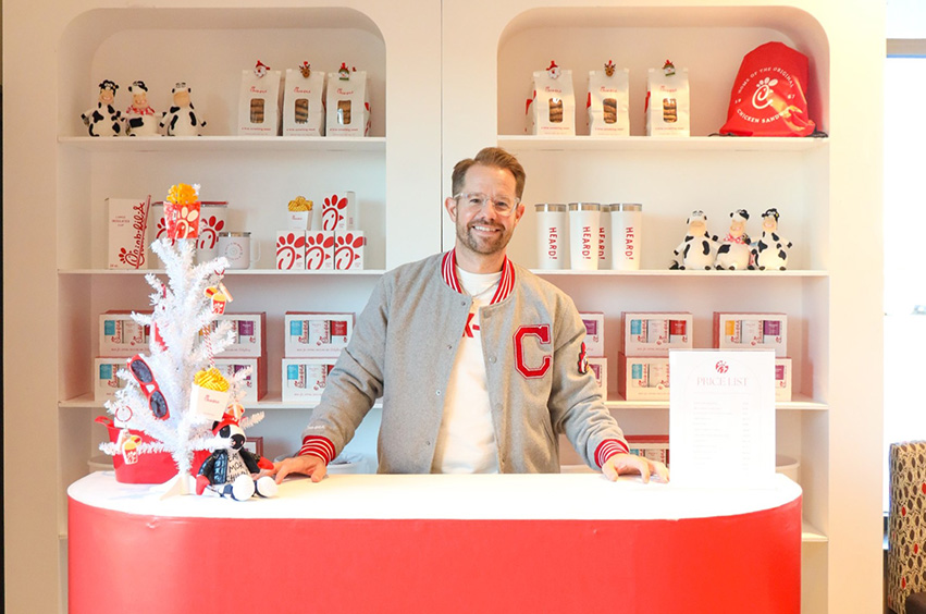 Tyler Haile standing at a booth