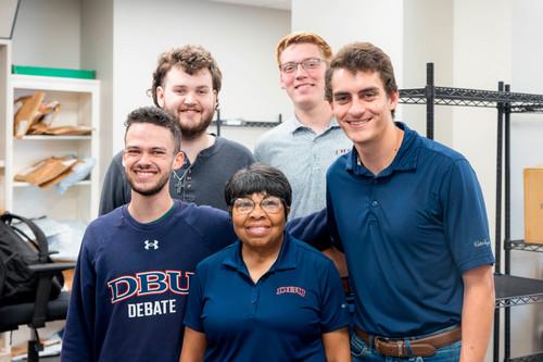 Group photo of Linda Smith with her staff in the Mail Room