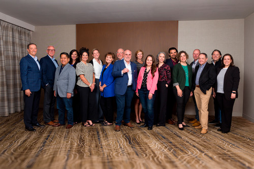 Team photo of Ed Fry and colleagues in a conference room
