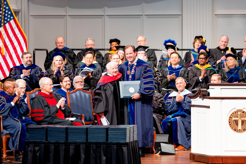 Lee Roy Mitchell receiving honorary degree from Dr. Wright
