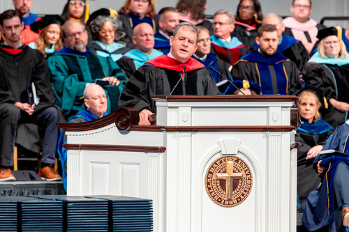 Bob Doll in Pilgrim Chapel delivering commencement address 