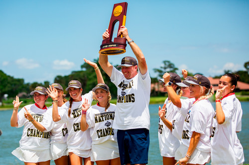 DBU team celebrates NCAA championship win-Coach lifts trophy