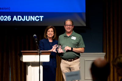 Chuck Roe receives Adjunct of the Year award from Dr. Hedin