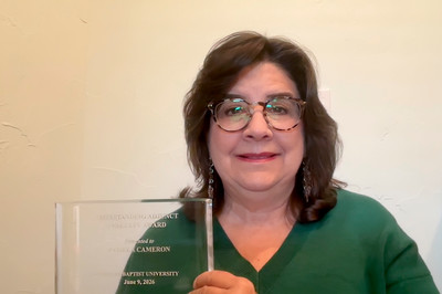 Pamela Cameron poses with DBU Adjunct of the Year award