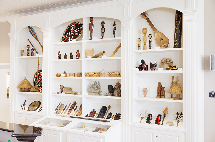 Display shelves with international artifacts in DBU's ICC 