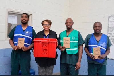InterLIFT staff and participants holding art supplies