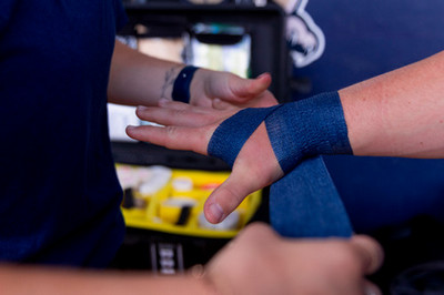DBU kinesiology student learning athletic ankle taping