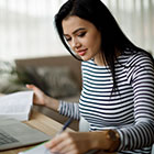 picture of a woman writing down in a journal