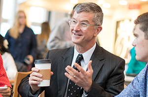 picture of a professor talking with college students at a Christian university in Texas