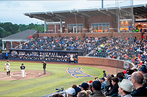 group of people watching the DBU patriots play baseball