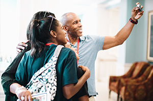 family standing together taking a picture