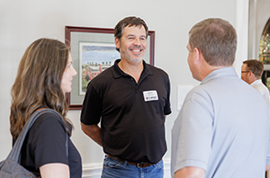 college parents standing together talking