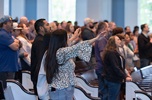 parents gathered together worshipping the Lord