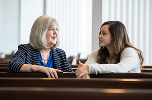 woman talking to a college student