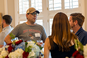 dbu parents talking at an event