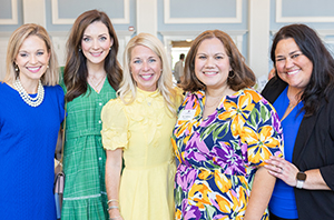 group of women standing together at DBU in the Great Hall