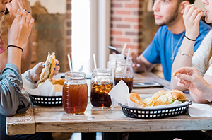 group of people sitting at a table in a restaurant in Dallas, Texas