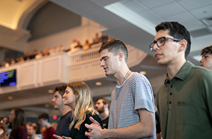 college students worshipping the Lord