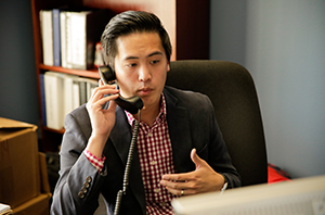 person talking on the phone talking to a customer