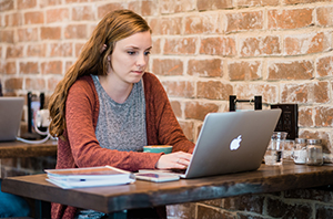 student researching how to best pay for a Christian college