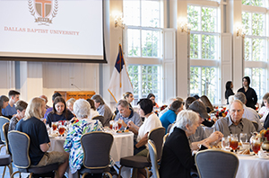 grandparents enjoying a special lunch with their college student