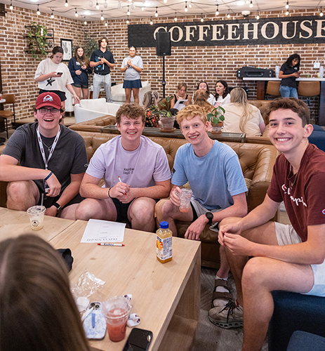happy students sitting in a coffeeshop