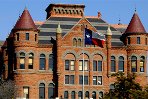 building with texas flag flying outside