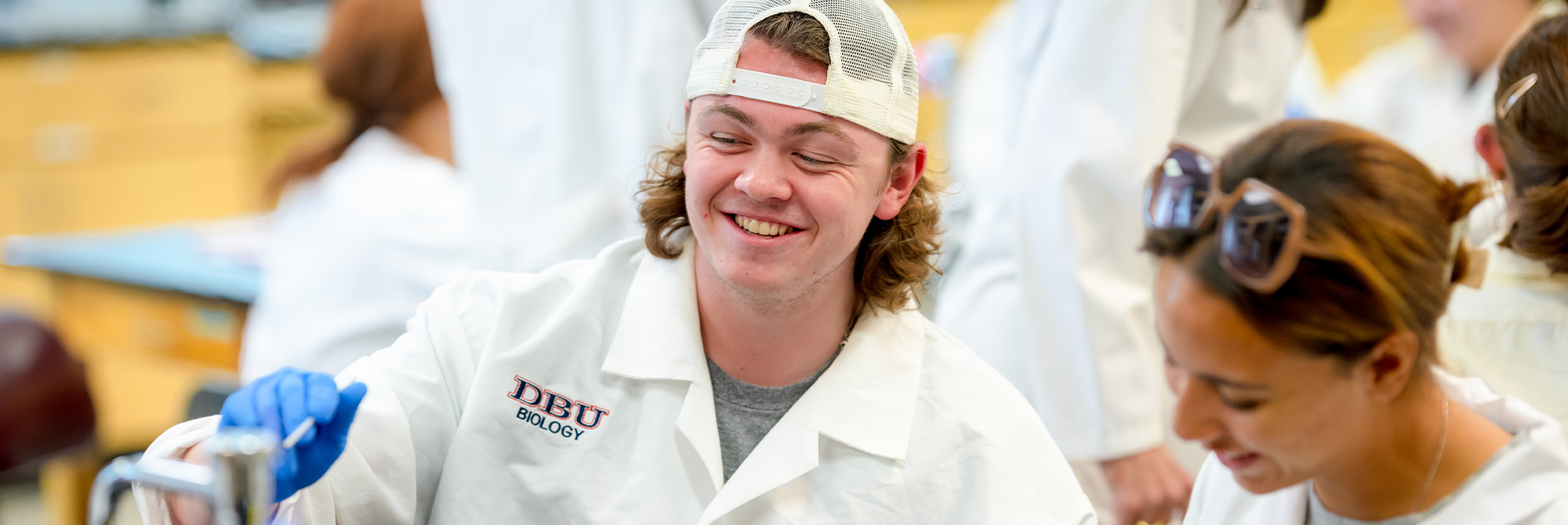 students laughing in science lab