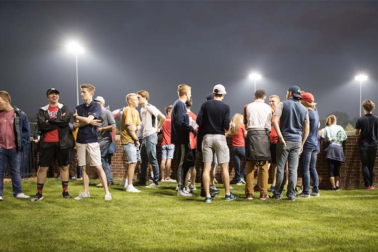 people standing around outside at Dallas baseball game