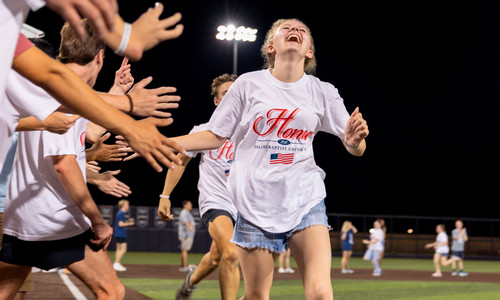 female college student running at SWAT event